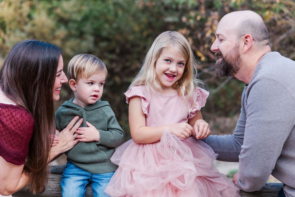 A series of candid outdoor family photos showing playful interactions in a natural setting during an autumn photoshoot.