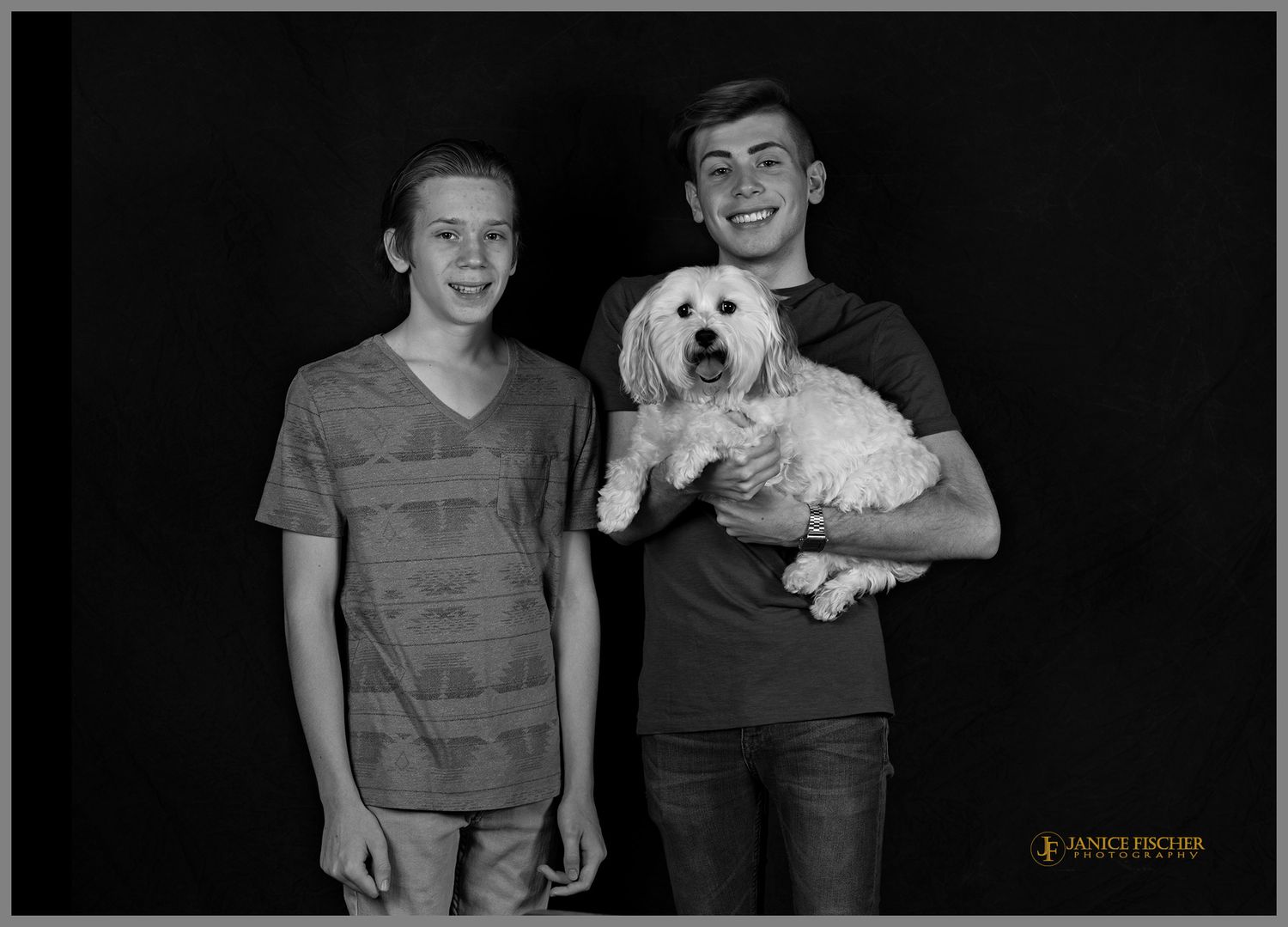 A classic black and white portrait of two brothers and their Bichon dog.
Pet photography in Northern Illinois and Southern Wisconsin.