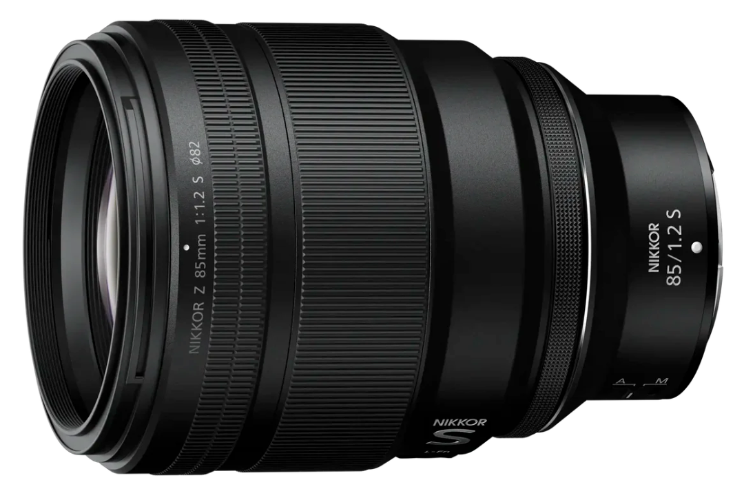 Four black Nikon Z-mount camera lenses of varying sizes arranged in a row against a white background.