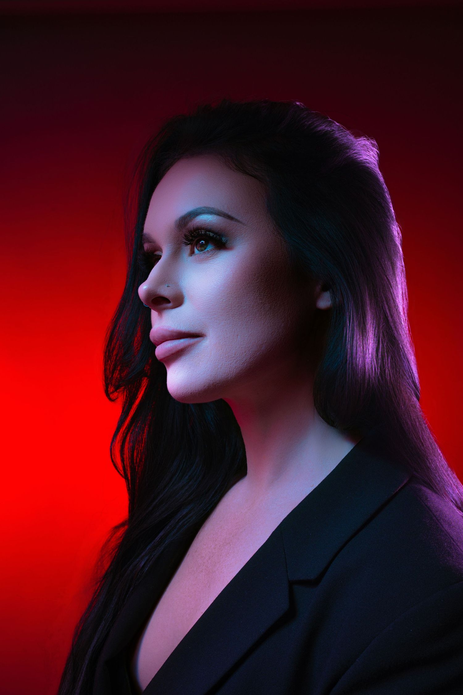 Dramatic portrait series with purple and red lighting showing profile views against dark background.