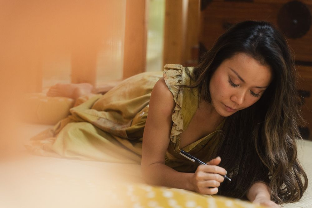 Candid documentary-style portrait of a creative professional at home.