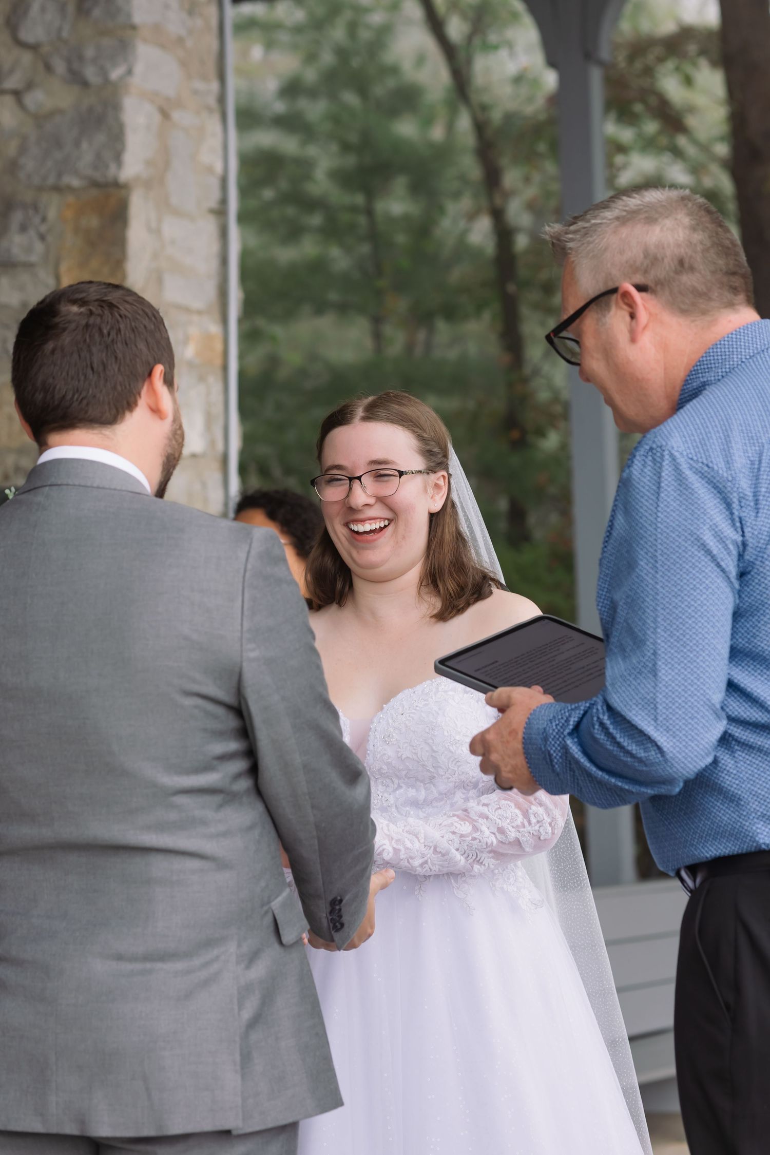 A series of candid wedding photos showing guests greeting and hugging the bride in a white lace dress.