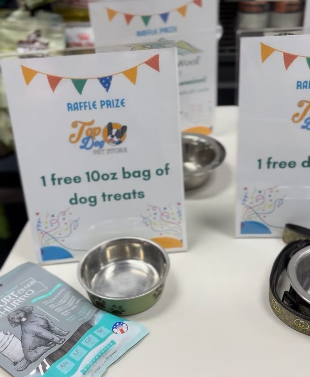 Small business raffle display with colorful bunting banners and prize cards arranged on a table.