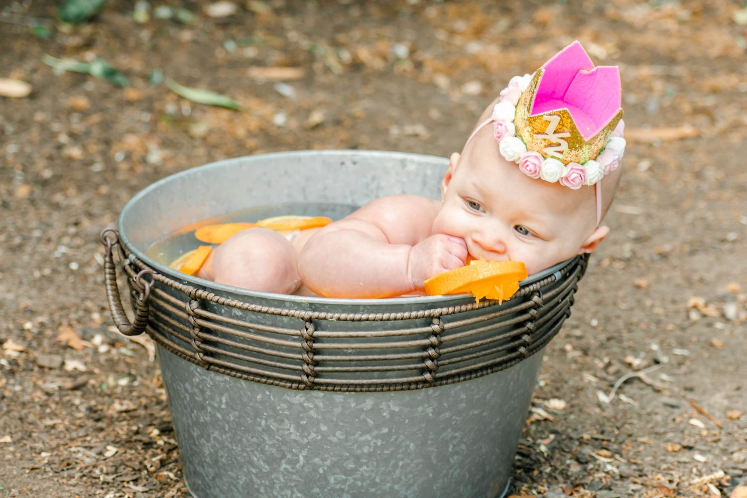 A series of images showing hands placing colorful objects into a black camping pot outdoors.
