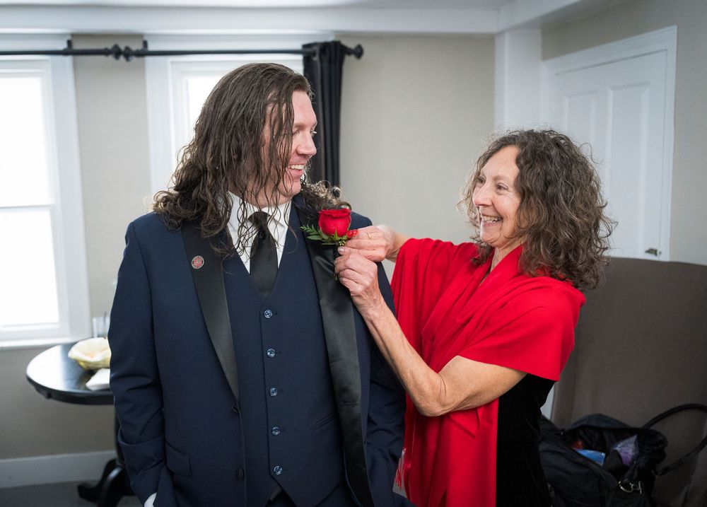 Series of candid moments showing couple sharing first look reactions at winter wedding.