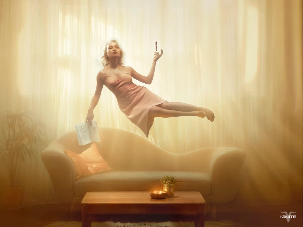 A person in a flowy dress dances gracefully in front of a sunlit window creating a dreamy silhouette effect.