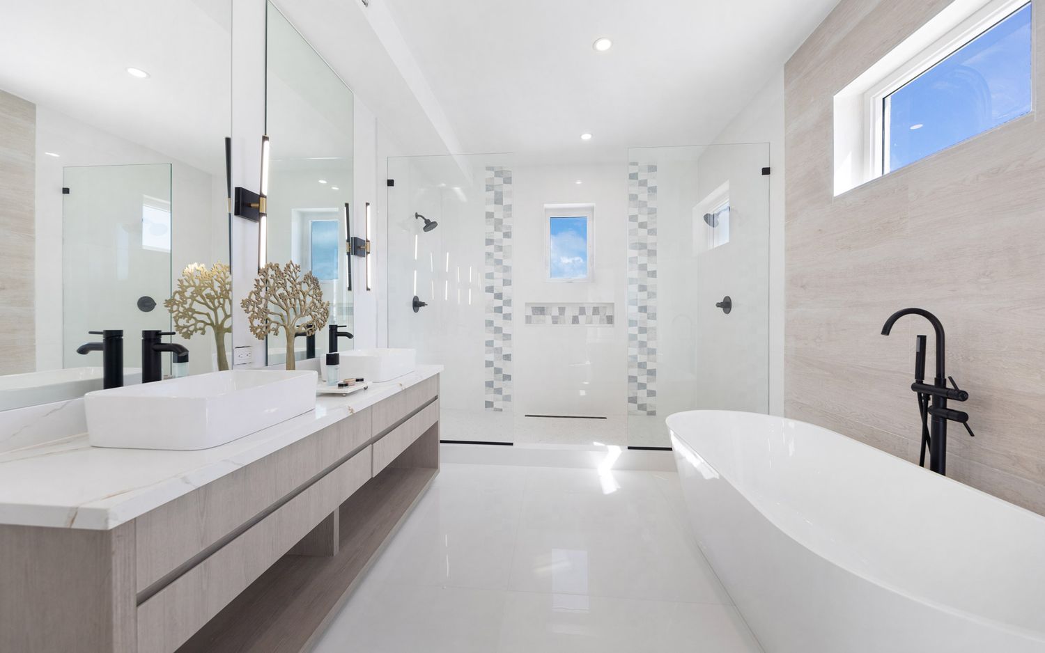 Modern white bathroom interior with marble tiles, floating vanity, and sleek minimalist design features.