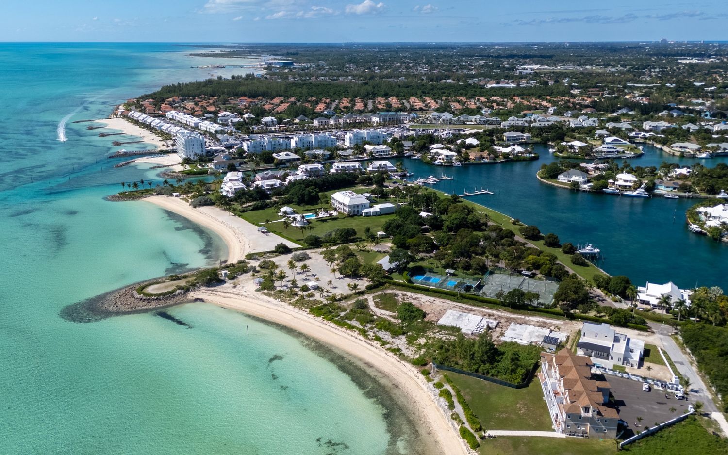 Aerial panoramic view of coastal Florida Keys with turquoise waters, sandy beaches and residential developments.