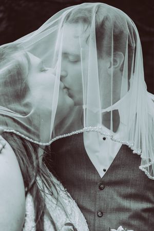 Black & White Editorial Wedding Photo of Couple under Veil taken in Blacksburg, Va.