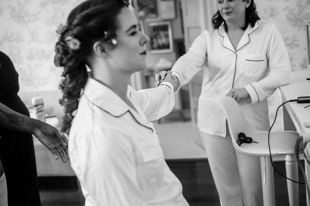 A series of black and white photos showing an intimate wedding first dance moment.