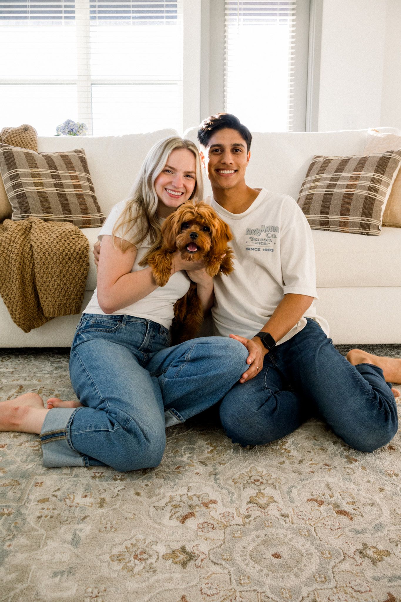 couple holding dog