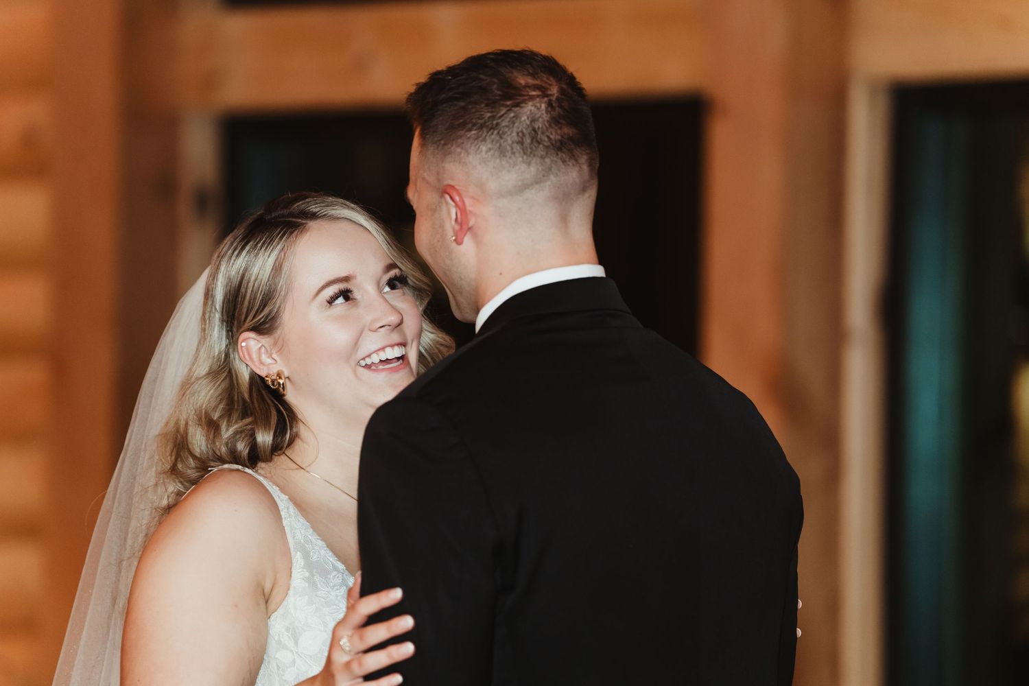 Bride smiling at groom during their first dance