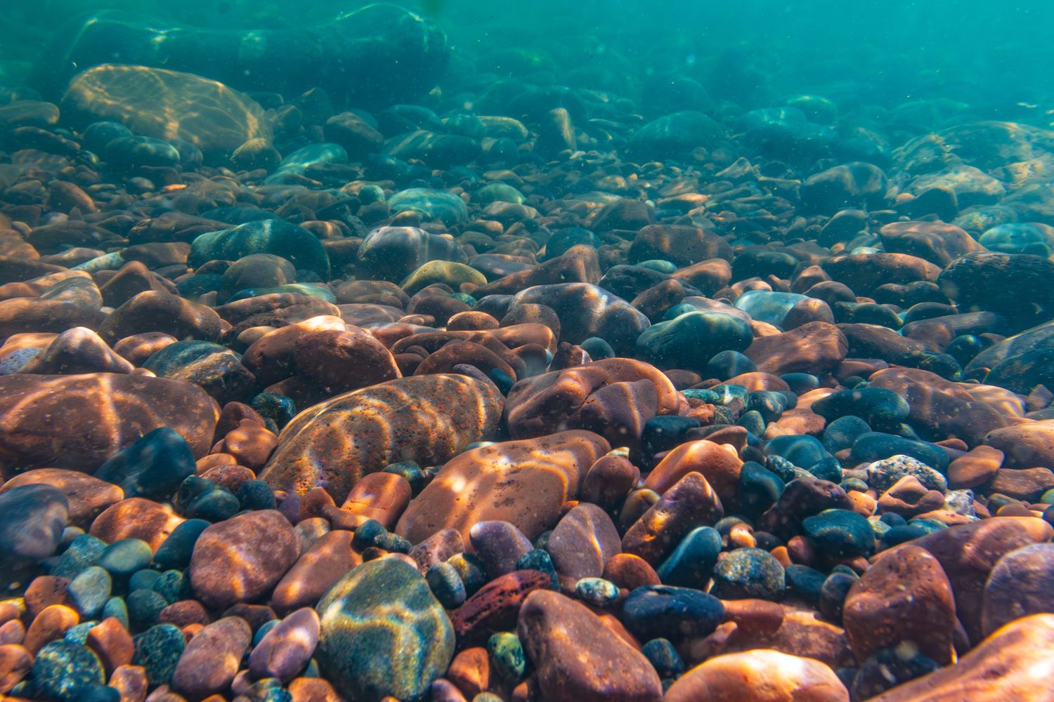 Long exposure underwater landscape photography showing colorful rocks on the shores of Lake Superior  in Minnesota, calming nature wall art.