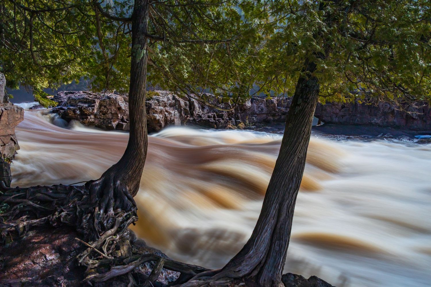 Long exposure fall waterfall landscape photography showing cascading waterfall of Gooseberry Falls State Park MN, calming nature wall art.