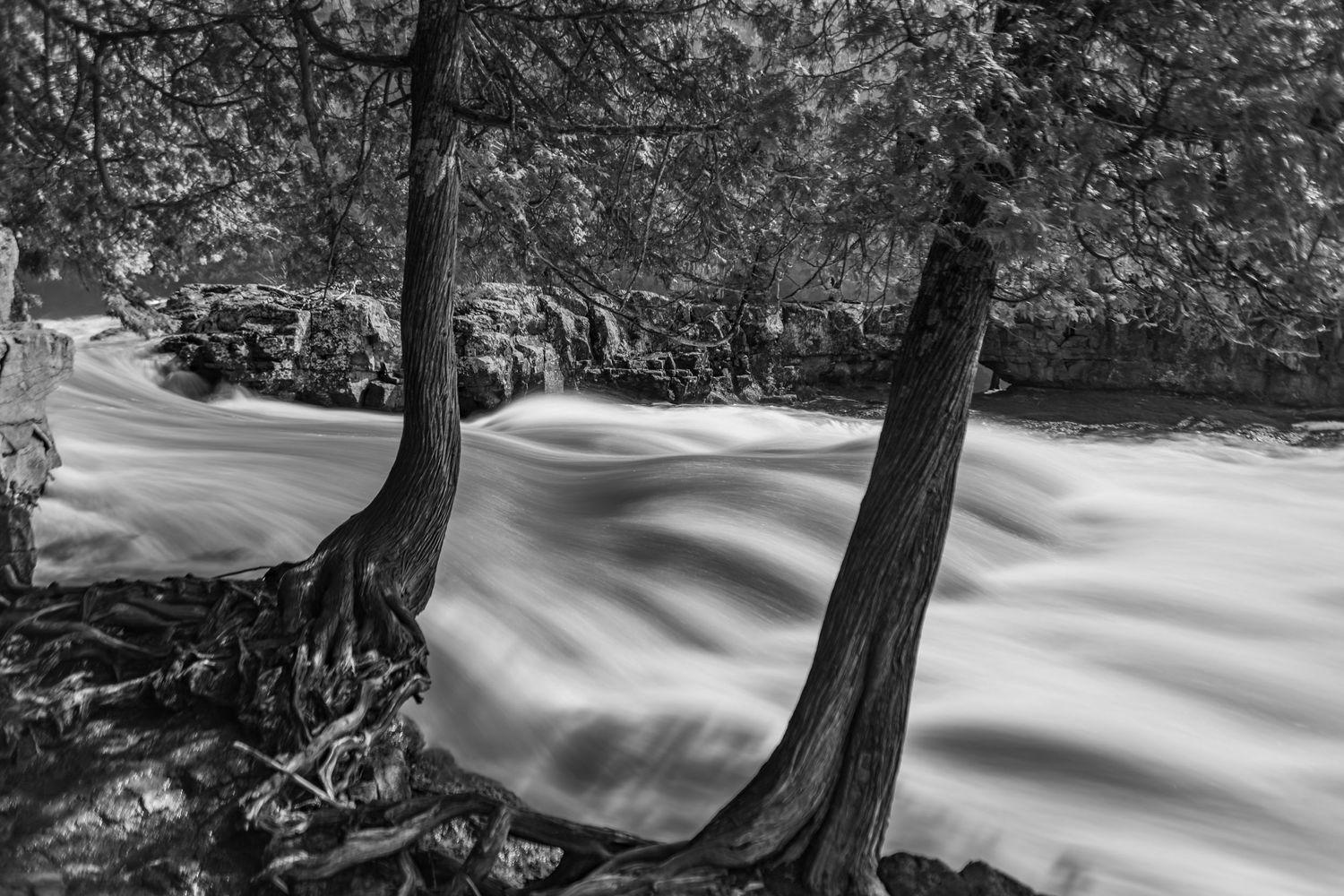 Long exposure fall waterfall landscape photography showing cascading waterfall of Gooseberry Falls State Park MN, calming nature wall art.