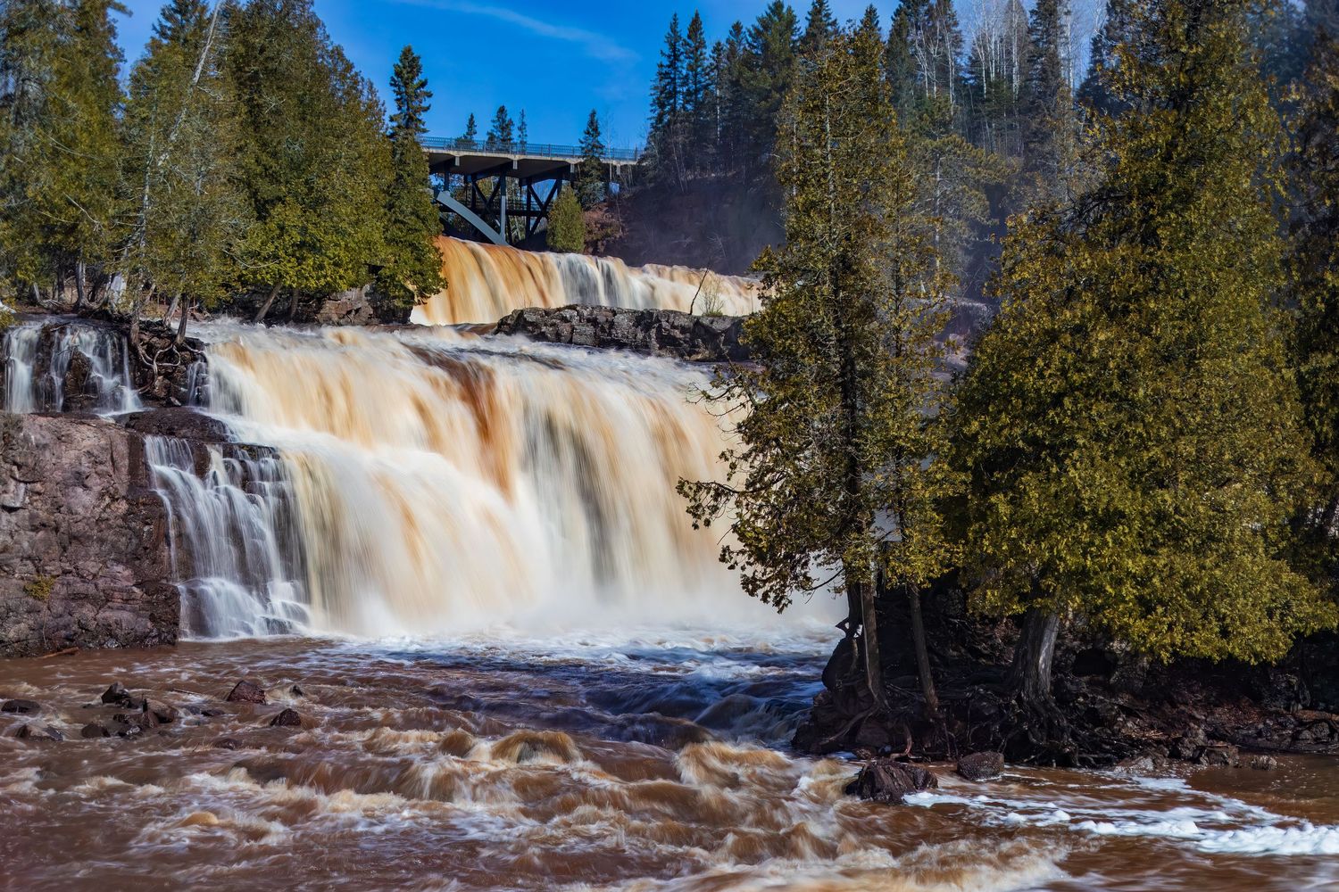 Long exposure fall waterfall landscape photography showing cascading waterfall of Gooseberry Falls State Park MN, calming nature wall art.
