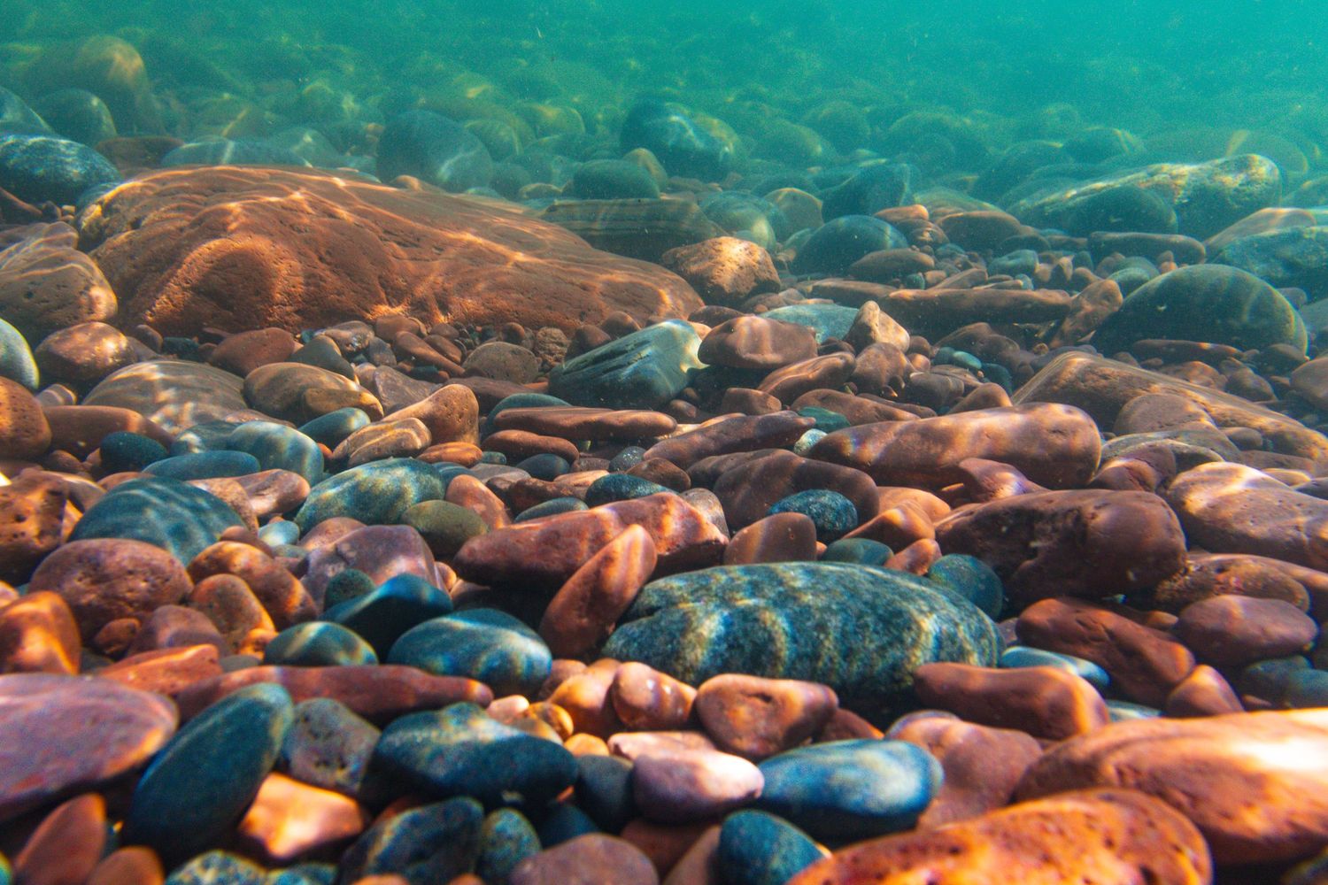 Long exposure underwater landscape photography showing colorful rocks on the shores of Lake Superior  in Minnesota, calming nature wall art.