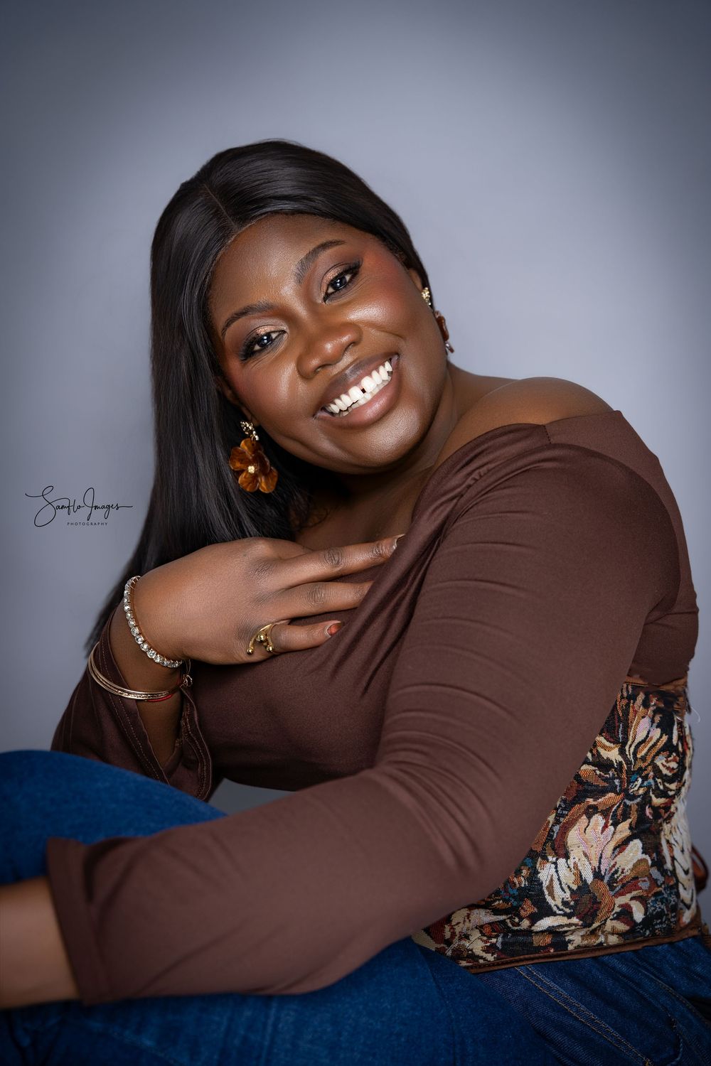 A series of studio portraits showing joyful expressions against a dark background while wearing a brown top with decorative sleeves.