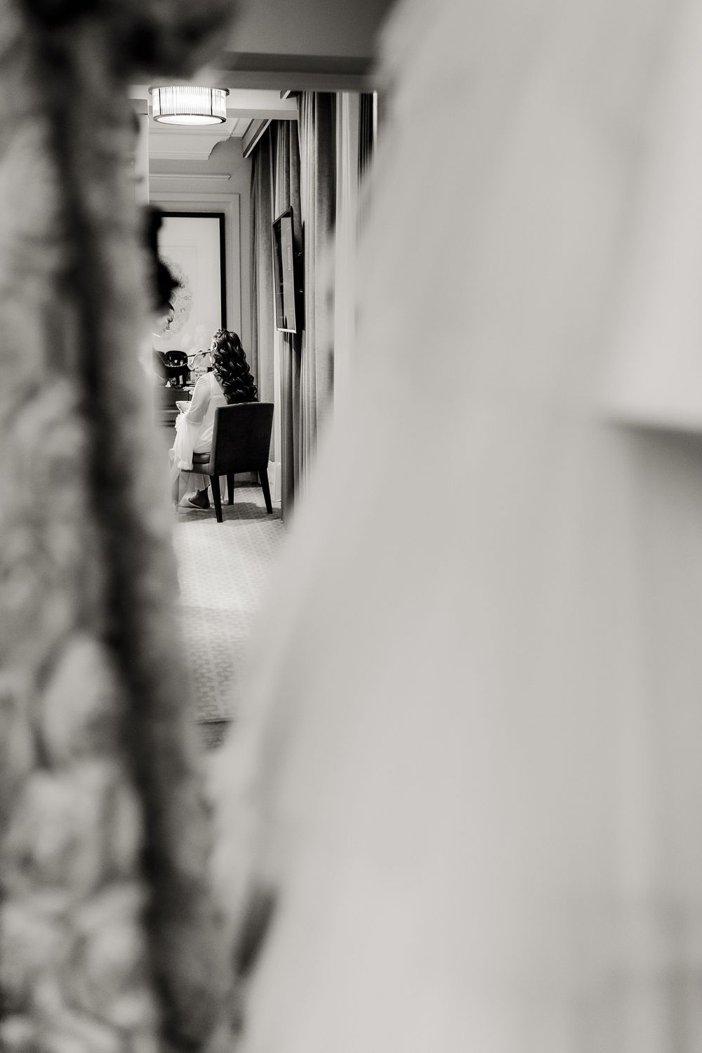Black and white hallway interior with blurred edges creates a mysterious and atmospheric architectural perspective.