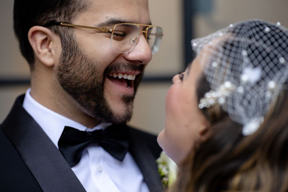 Close-up candid wedding photos showing joyful laughter and intimate moments between newlyweds.