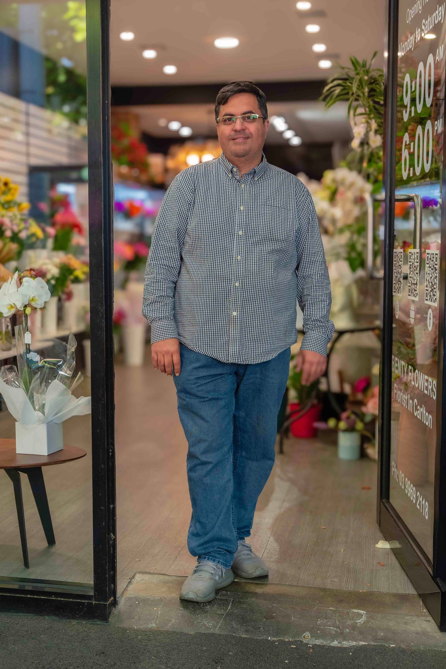 Interior view of a flower shop with bright lighting and floral displays. in Melbourne photography in a shop