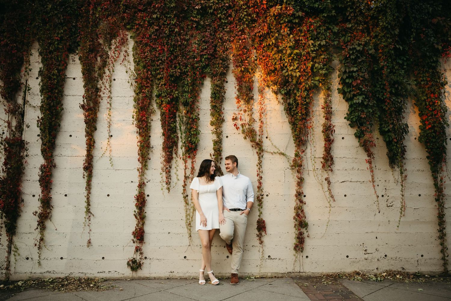 A joyful moment captured in a meadow of white wildflowers during golden hour.