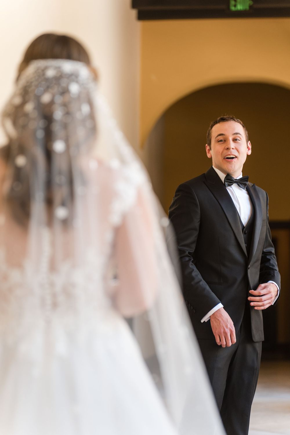 Groom reacting to bride during first look at Hotel El Convento in Old San Juan