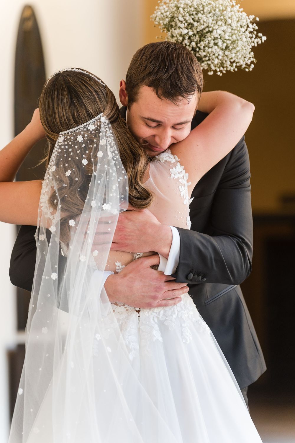 Groom hugging bride during first look moment at Hotel El Convento Puerto Rico