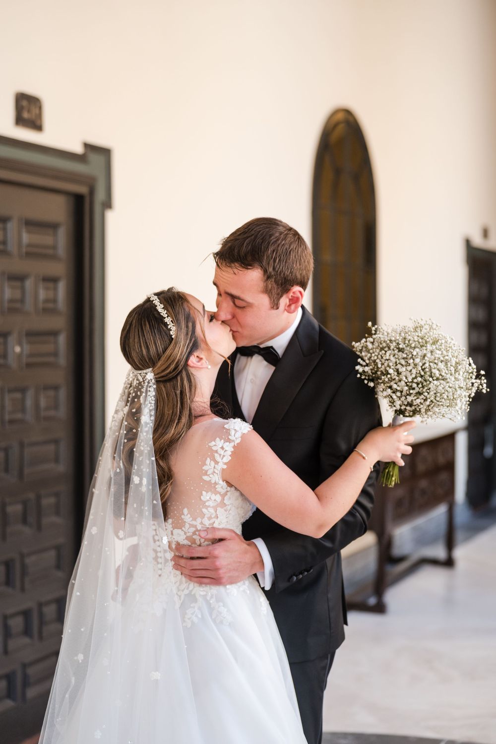 Bride and groom embracing during first look at Hotel El Convento in Old San Juan