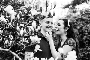 A black and white photo collage of joyful wedding moments showing couples embracing and celebrating outdoors.