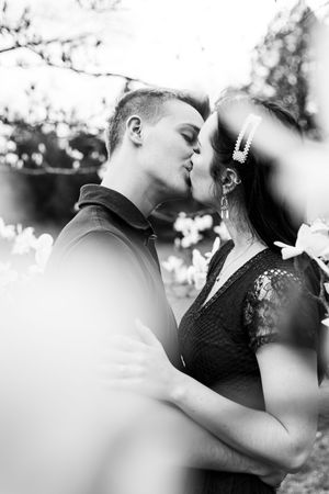 Artistic black and white series of romantic couple portraits with dreamy bokeh effects.