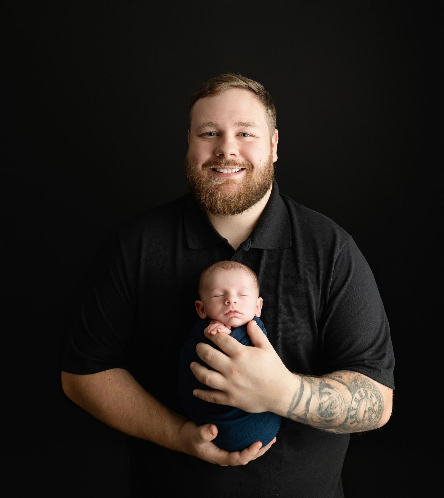 A father holding his newborn and smiling. Greenville, SC newborn photographer, Easley SC newborn photographer, Upstate SC newborn photograph