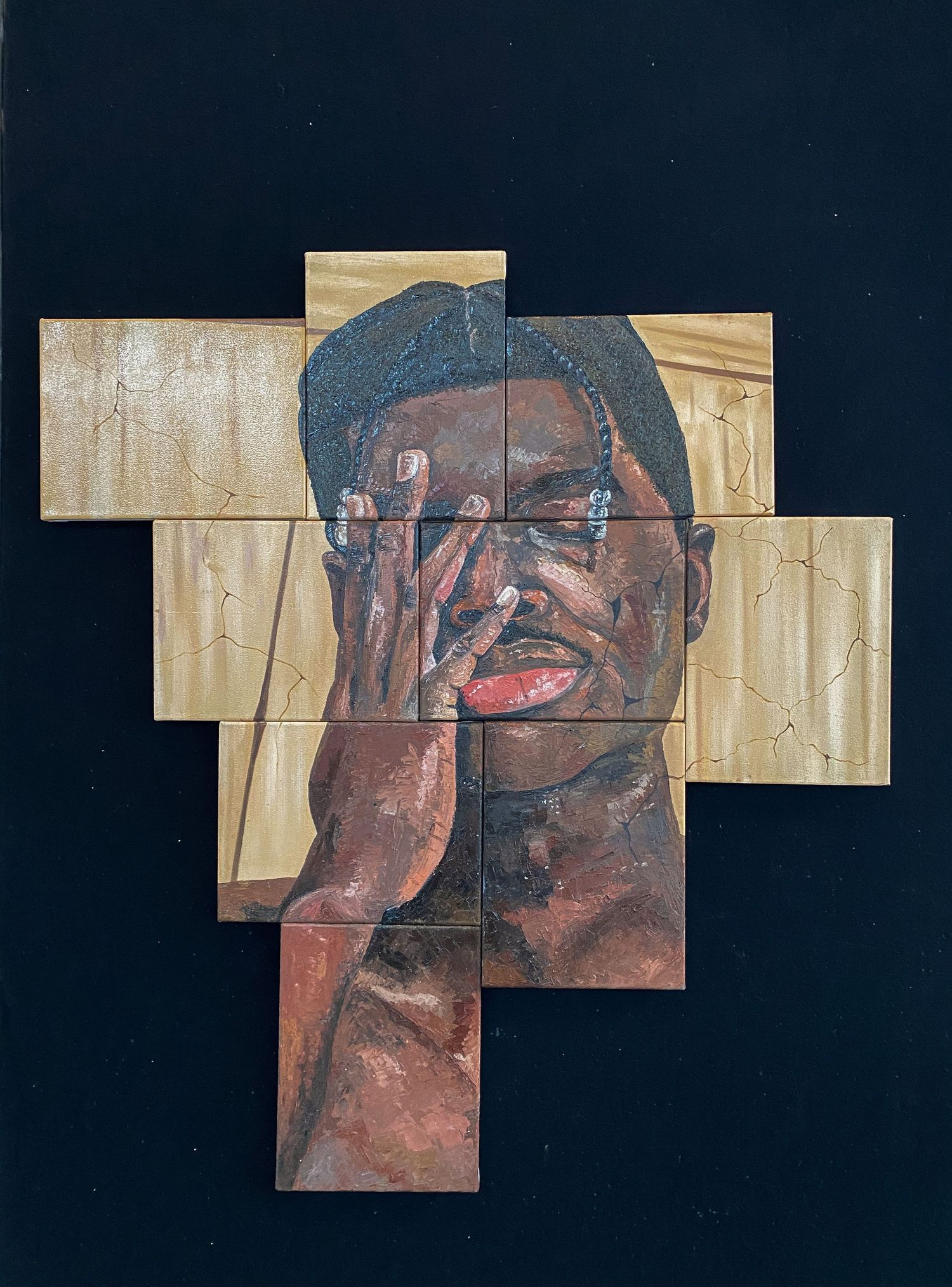 Mixed media portrait artwork of a person covering face with hand, painted on wooden block tiles.