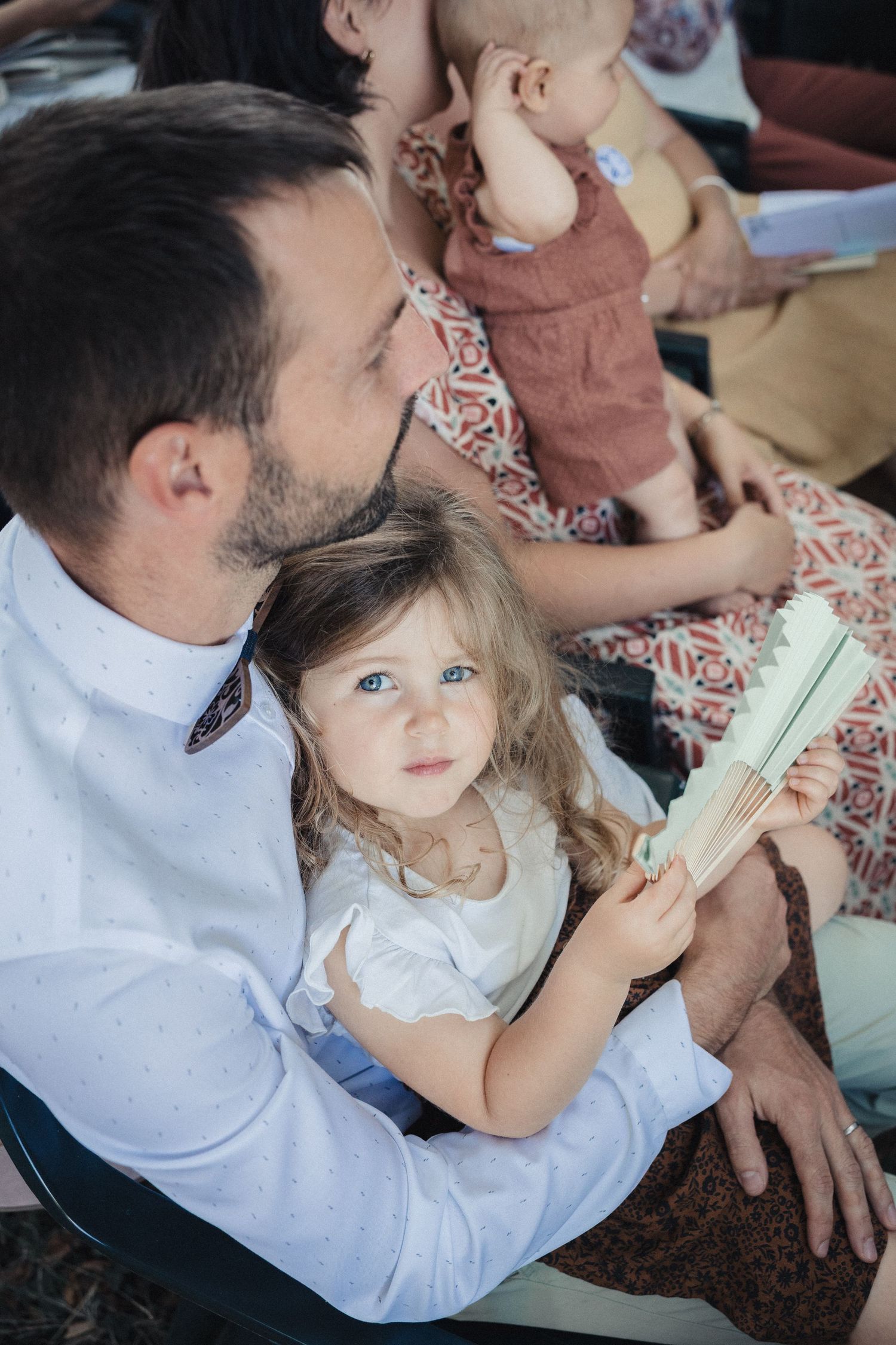 Parent and child sharing sweet moment while sitting together.
