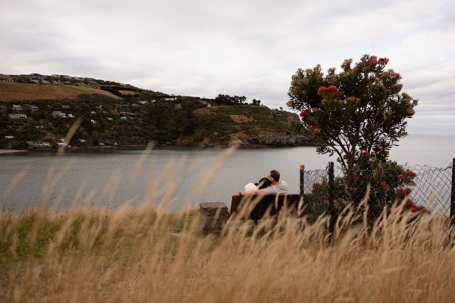Couple enjoying the view at Taylors Mistake while on holiday in New Zealand