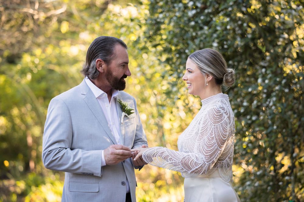 A romantic outdoor photo sequence showing a couple in wedding attire sharing intimate moments in a garden setting.