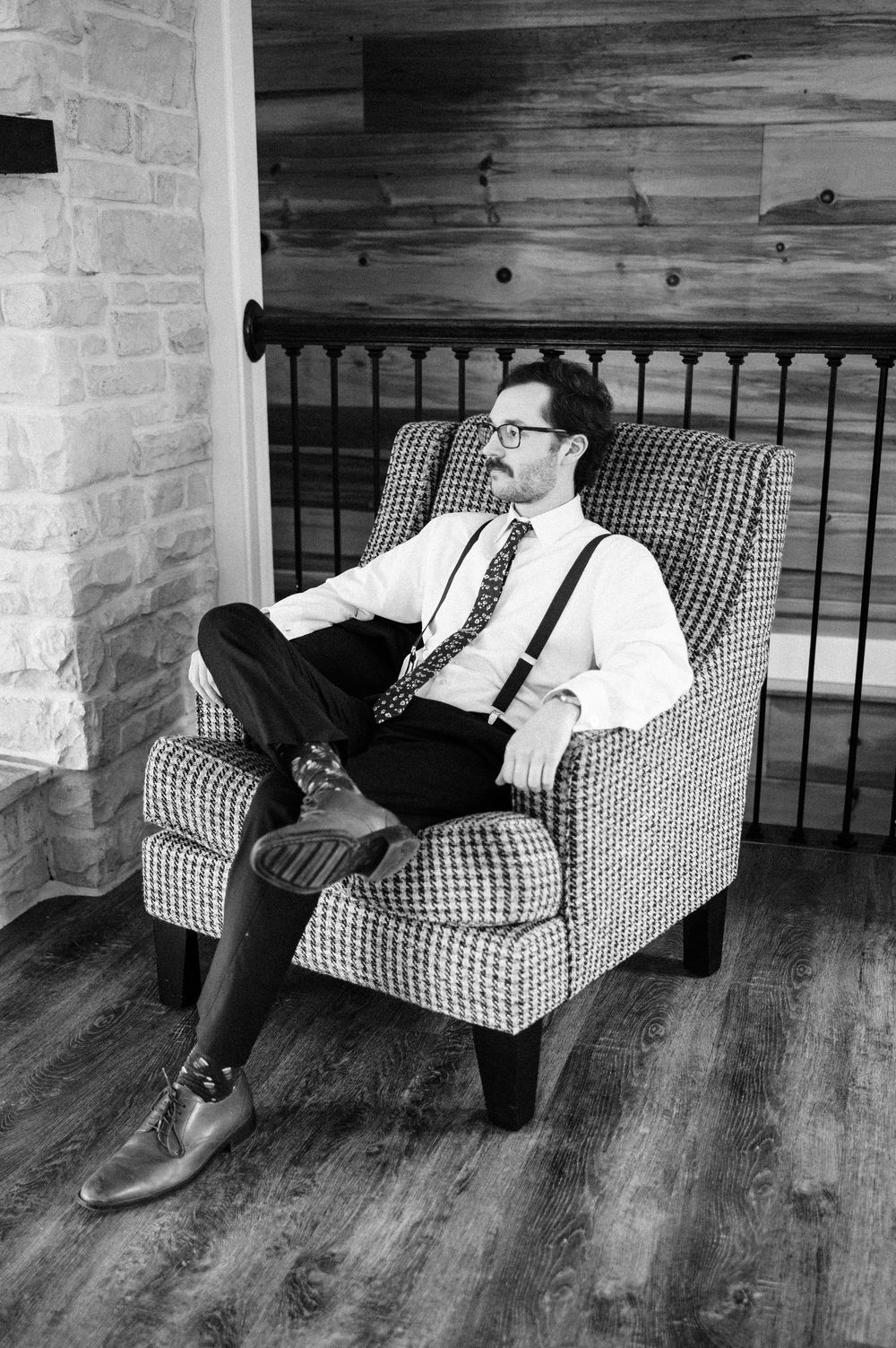 A black and white sequence showing someone progressively falling asleep on a checkered couch.