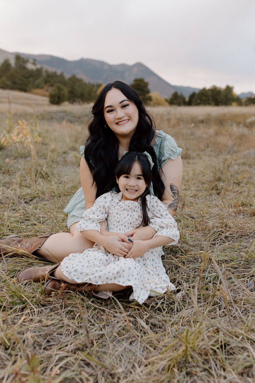 Candid moment of joy captured during outdoor portrait session in mountain terrain. Colorado Springs Photographer.