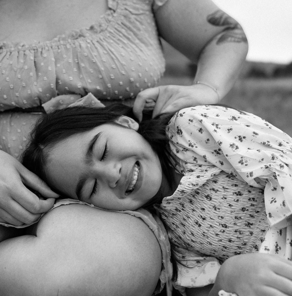A black and white close-up portrait showing joy and laughter. Colorado Springs Photographer.