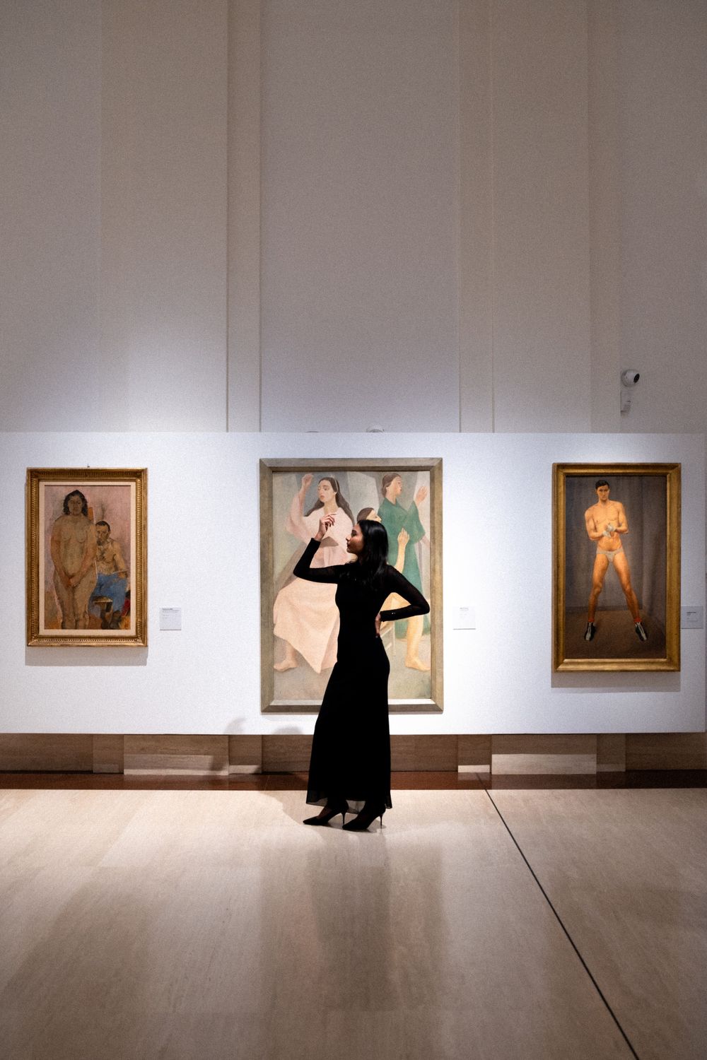 Woman in black dress posing in Rome Museum, photographed by Milan photographer Sydney Duncan.