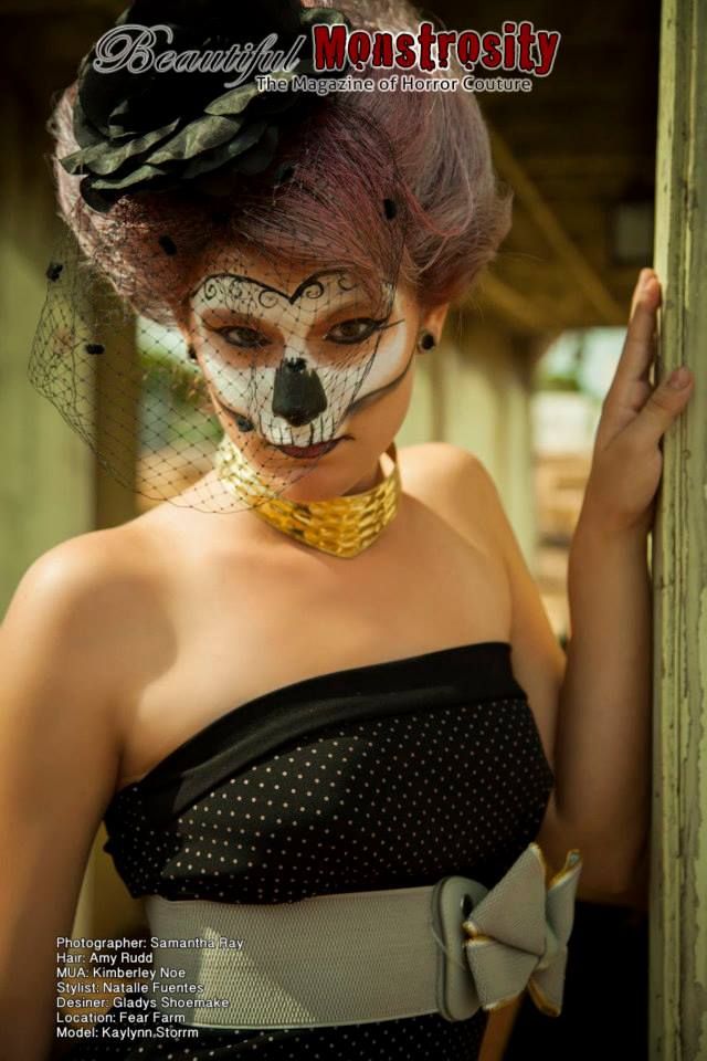 Dark glamour portrait with model in strapless dress wearing Dia de los Muertos makeup.