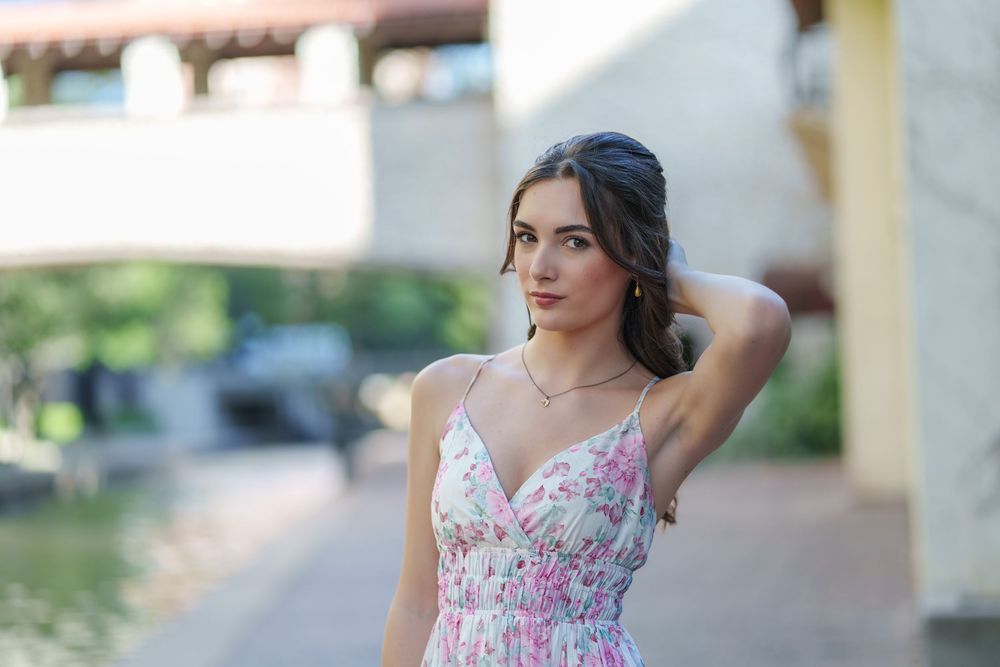 Senior photos 2025 class Los Colinas Irving Texas Mandalay Canal floral dress outfits poses ideas outdoors golden hours graduation