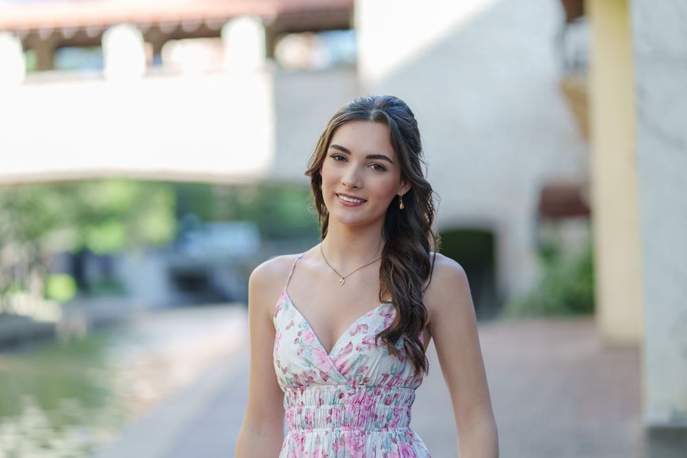 Senior photos 2025 class Los Colinas Irving Texas Mandalay Canal floral dress outfits poses ideas outdoors golden hours graduation