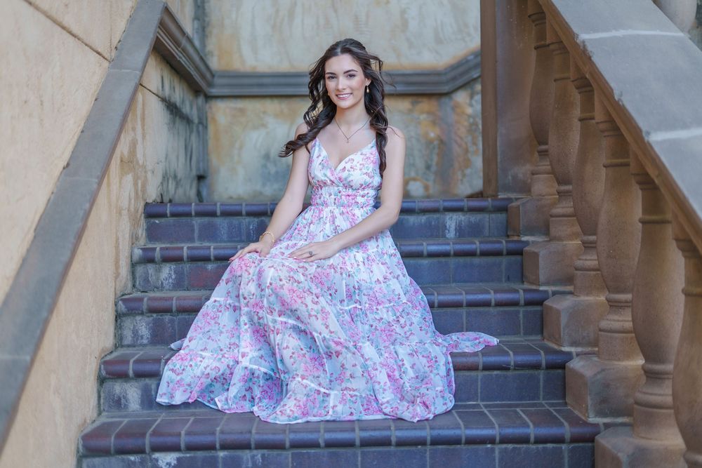 Senior photos 2025 class Los Colinas Irving Texas Mandalay Canal floral dress outfits poses ideas outdoors golden hours graduation