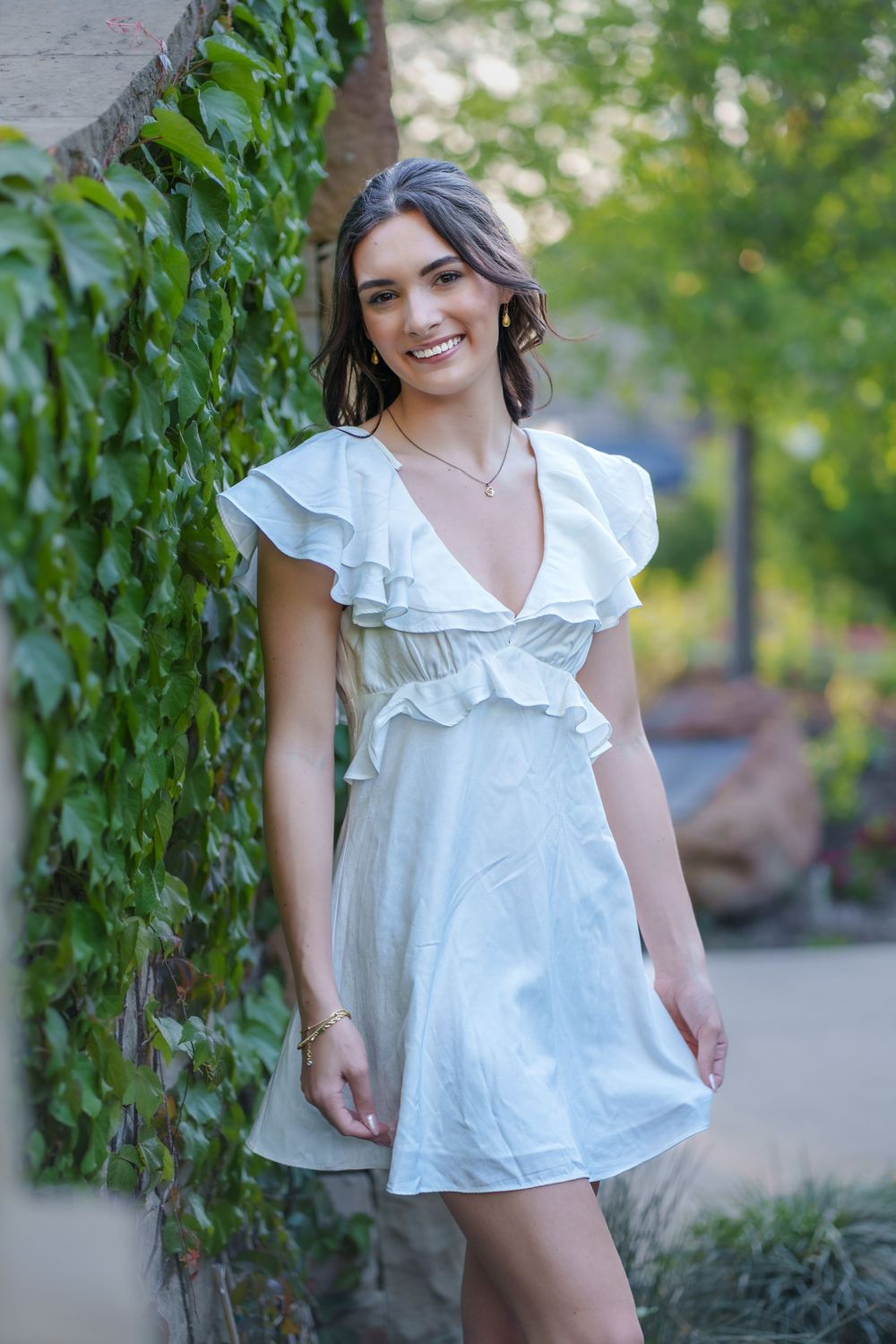 Senior photos 2025 class Los Colinas Irving Texas Mandalay Canal floral dress outfits poses ideas outdoors golden hours graduation