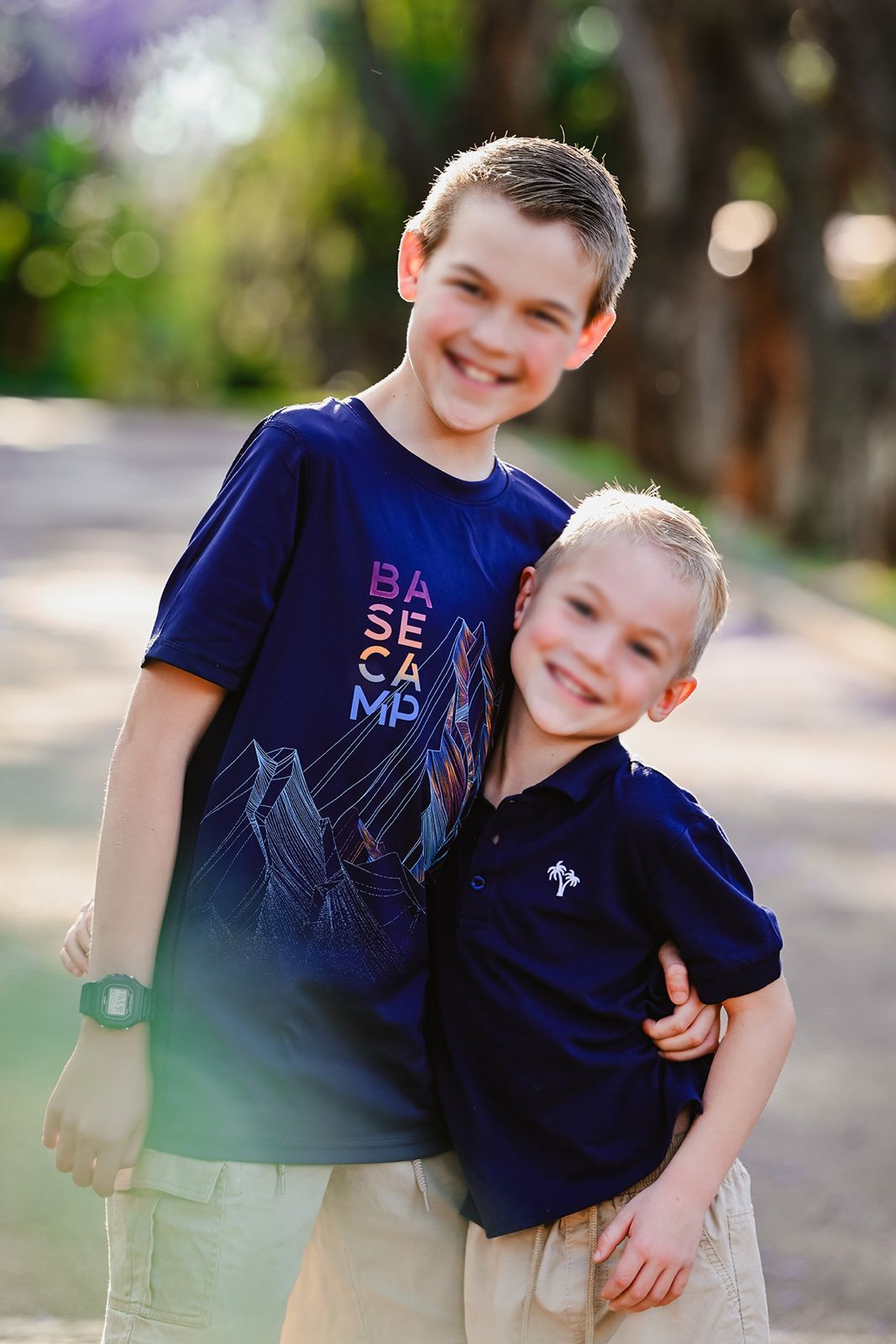 A picture of brothers posing at the camera for the annual Jakaranda portraits in Pretoria.