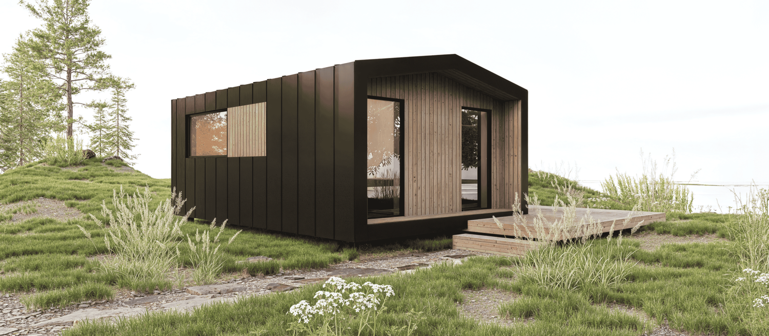 Sleek container-style home with black metal cladding and horizontal window design in desert setting.
