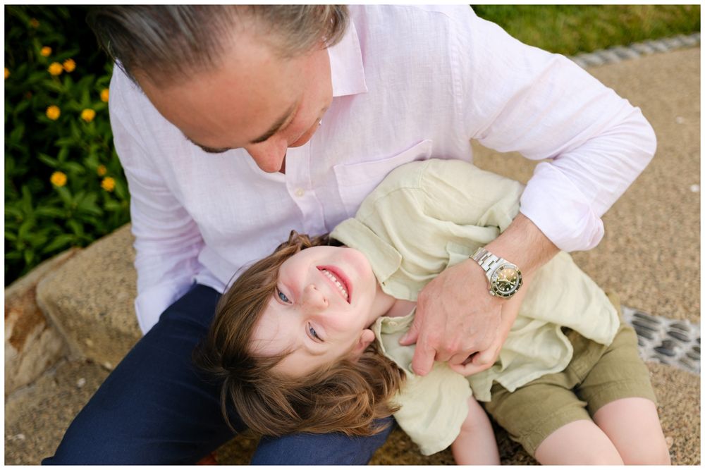 Parent and child playing together during a beach family photography session at St. Regis Punta Mita.