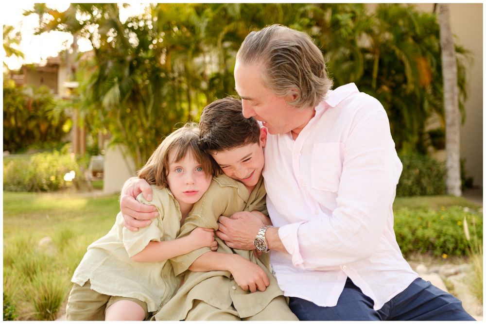 Family portrait during golden hour at St. Regis Punta Mita captured in the resort gardens.