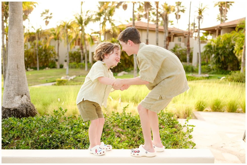 Playful portrait of two family members during an outdoor photography session at St. Regis Punta Mita.